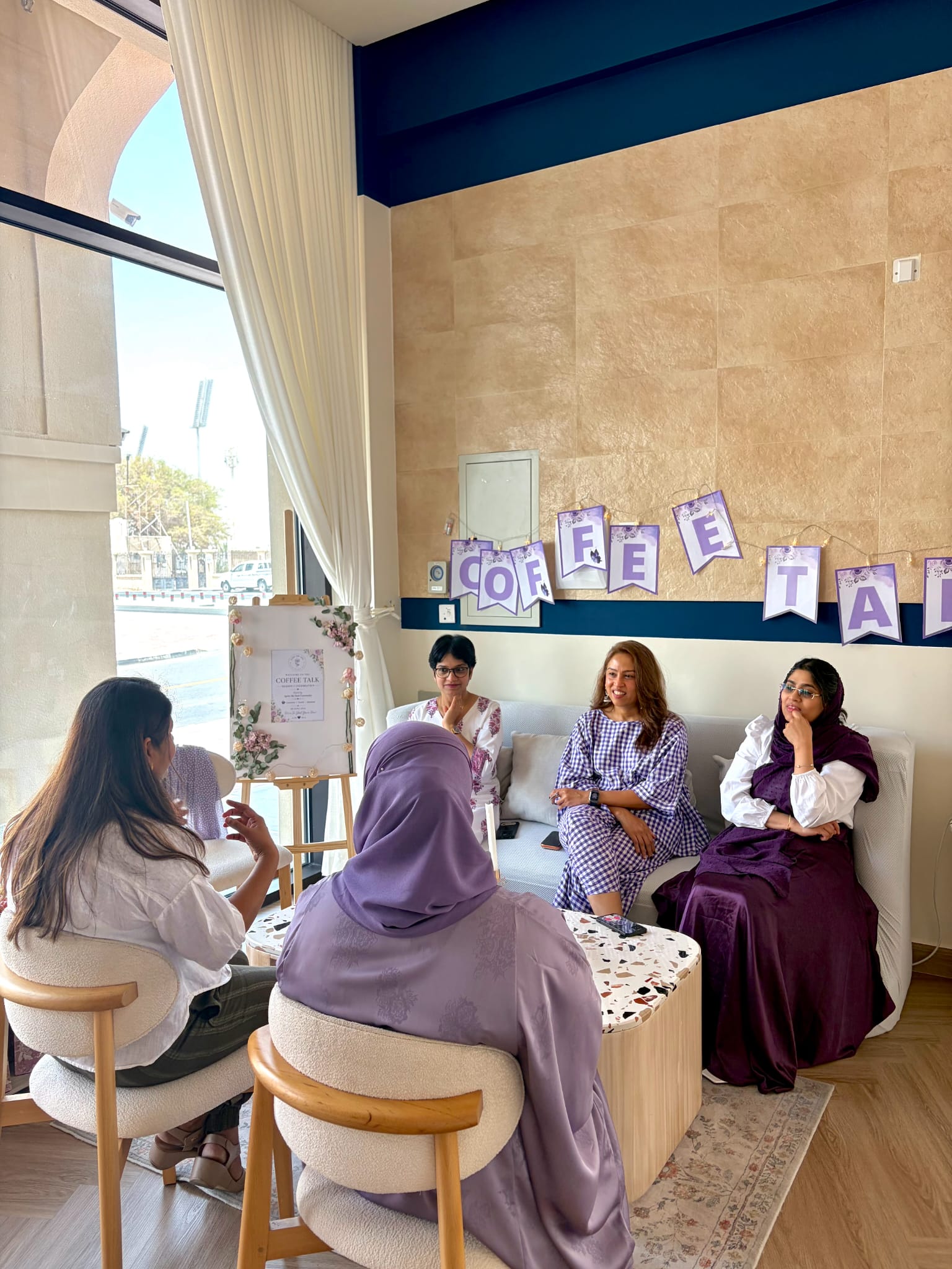 Women gathered together at a Coffee Talk community session
