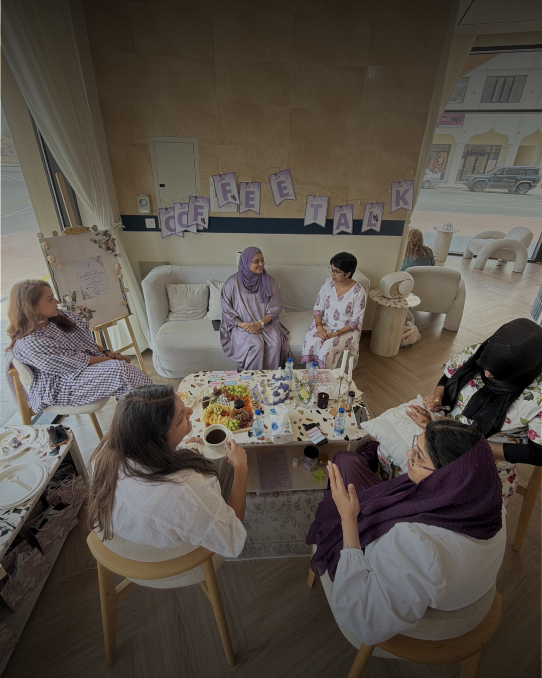 Women gathered together over coffee and conversation at a women's circle
