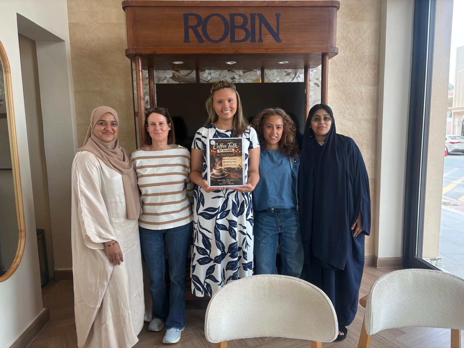 Women celebrating the first Coffee Talk session at Robin Cafe