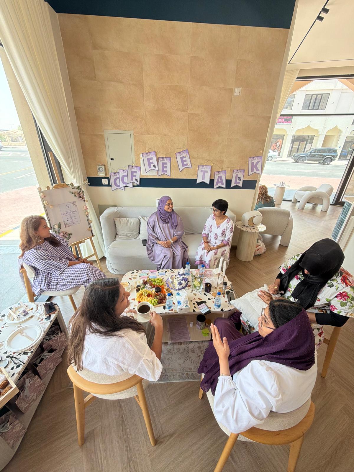 Women gathered together over coffee and conversation at a women's circle